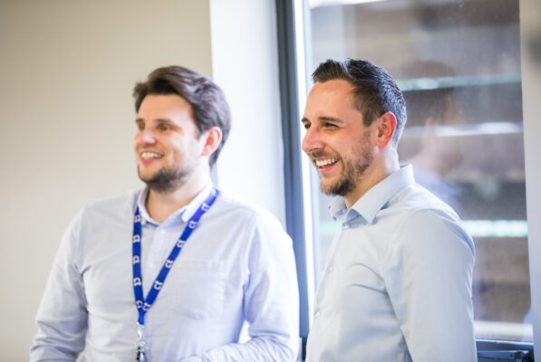 Image of 2 male members of staff at Central Technology, smiling