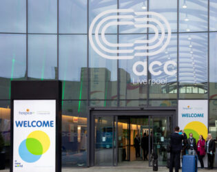 the front of the ACC building in Liverpool with Hospice UK banners