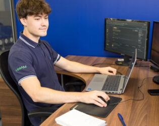 cyber security for education blog - employee working at desktop